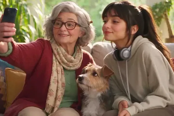 A grandmother, her granddaughter and their dog taking a selfie and seeing their RiBi avatars on the phone