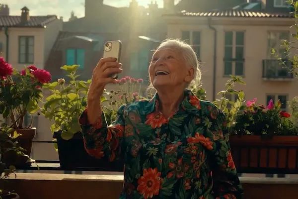 An older man taking a selfie on his balcony and turning into his RiBi avatar